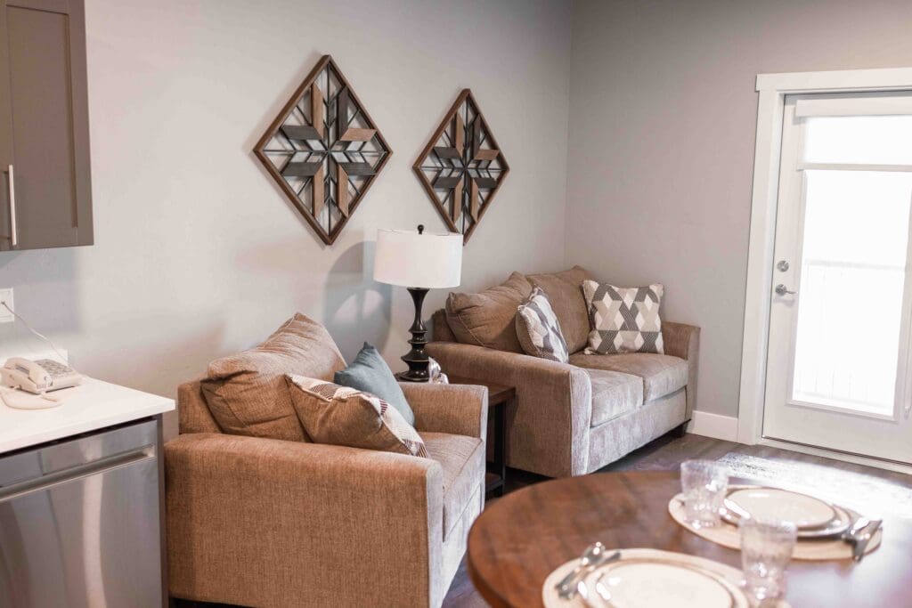 Interior image of The Summit of Coralville apartment living room and dining room.