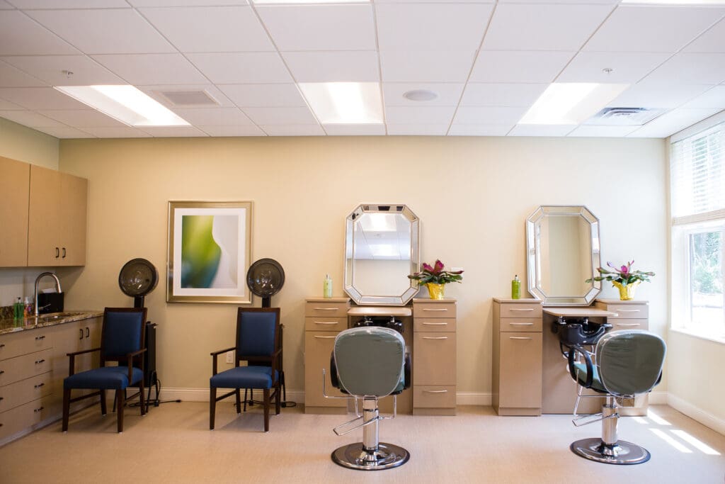 Interior shot of the salon and barber shop in the community common areas at The Summit of Coralville.