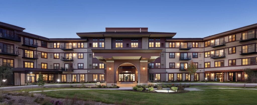 Exterior shot of The Summit of Coralville at dusk.