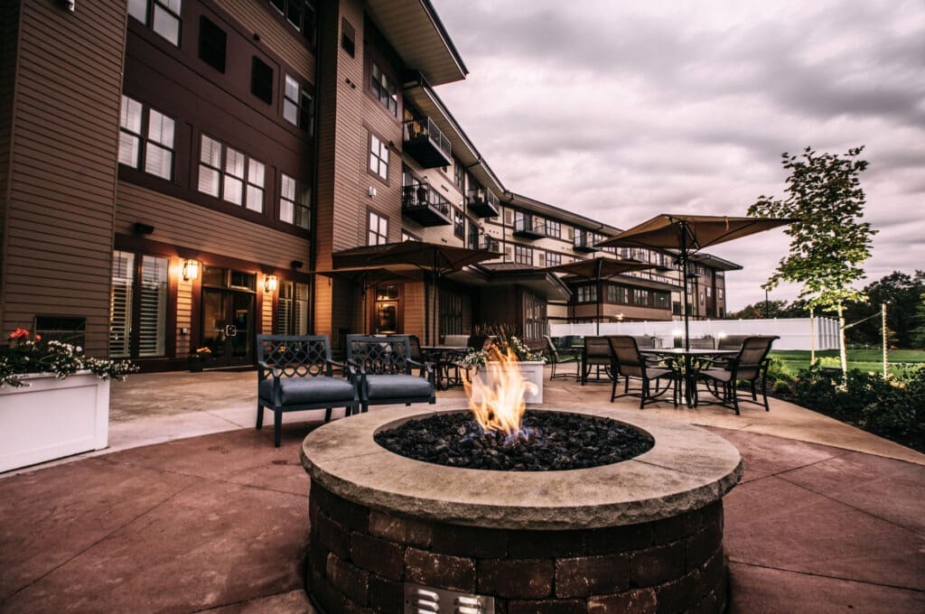 External image of The Summit of Coralville with a welcoming patio and bonfire.