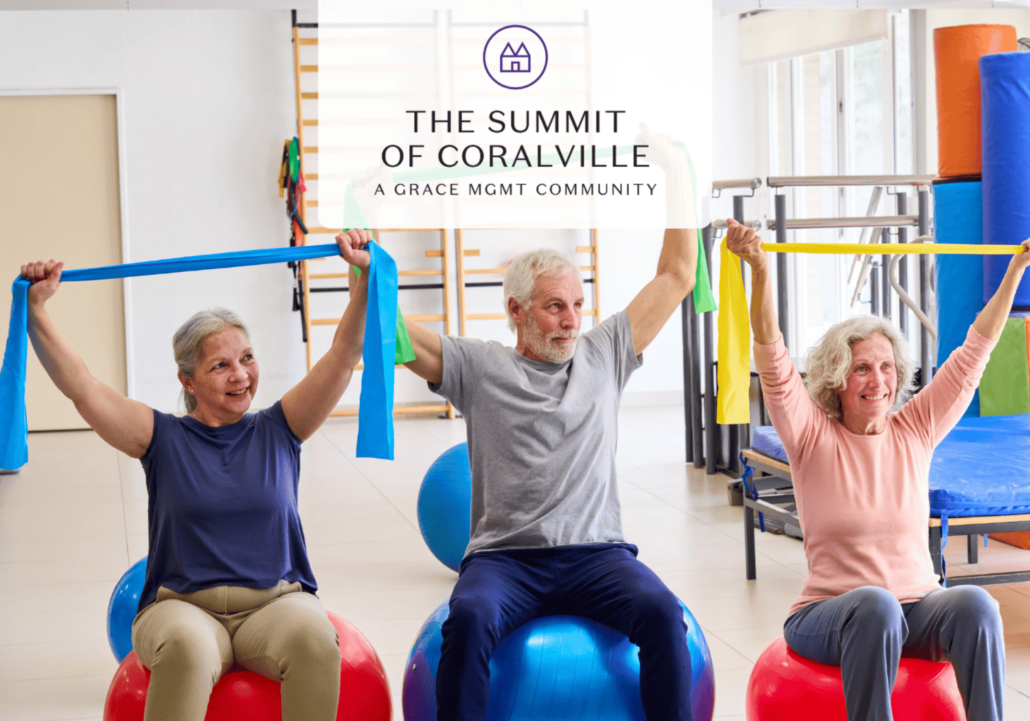 Three seniors exercise with colorful resistance bands while seated on stability balls in a bright gym, smiling at the camera,